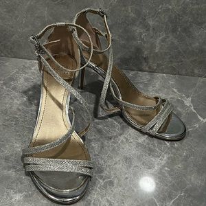 Simple, cute, silver sparkly sandals with a low heel